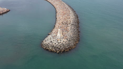 Flying-slowly-around-a-lighthouse-on-a-levee-Sete-France